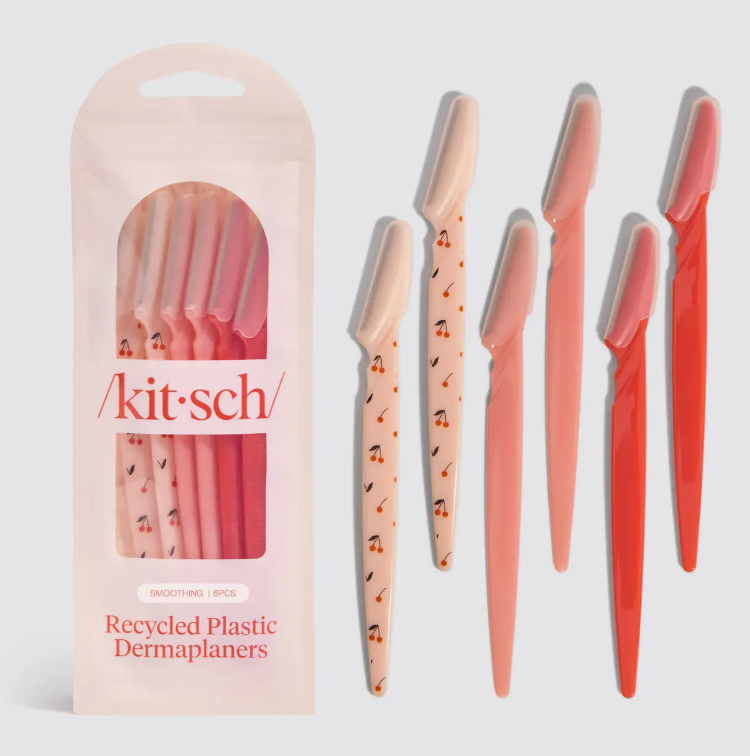 Set of dermaplaners with packaging labeled 'kit-sch' on a light gray background